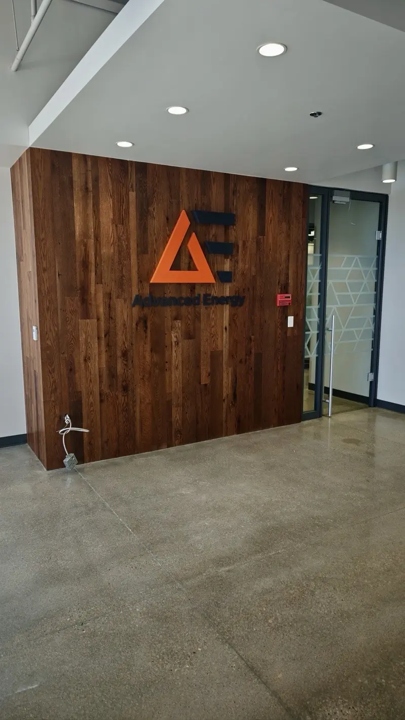 Advanced Energy Fort Collins reclaimed-wood logo wall